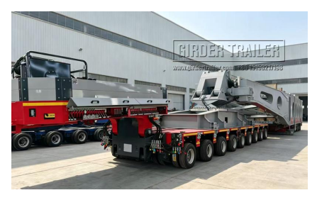 Modular trailer with red gooseneck loaded