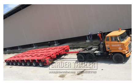 Red trailer axle lines being towed