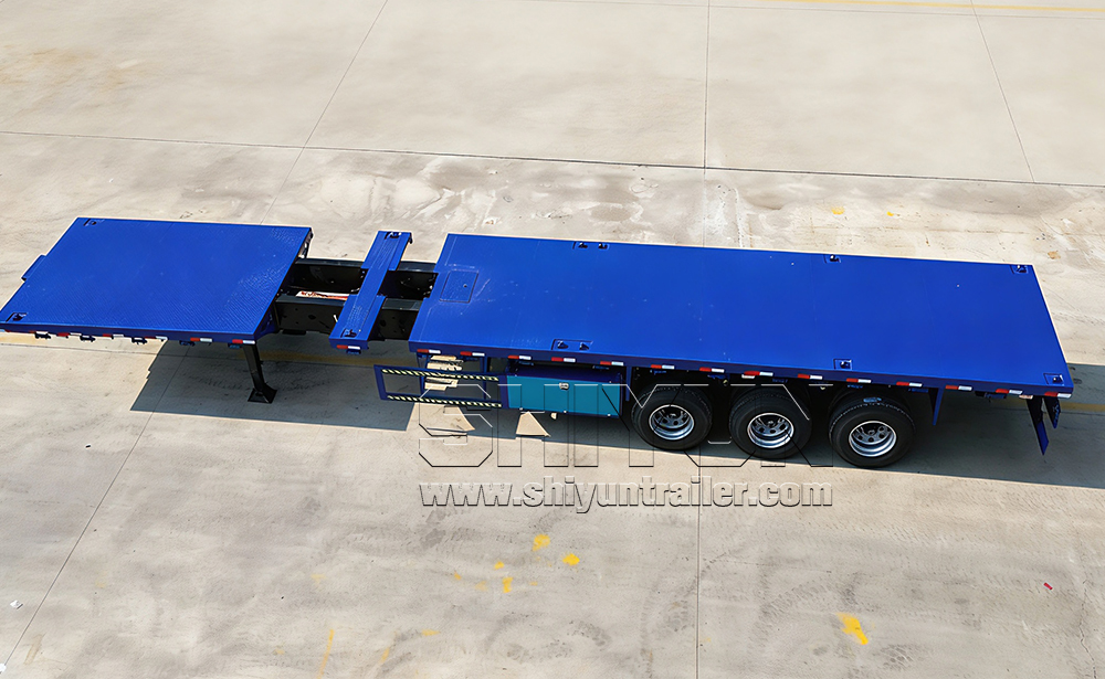 Blue extendable flatbed trailer