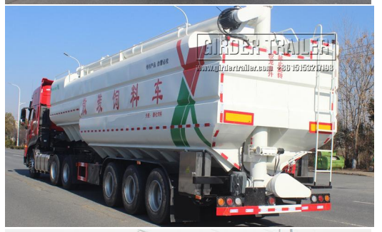 White bulk feed trailer with red truck head