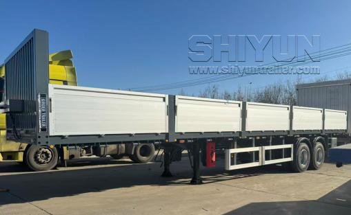 White drop side semi trailer side view