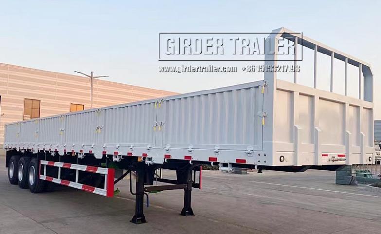 White drop side semi trailer with side panels