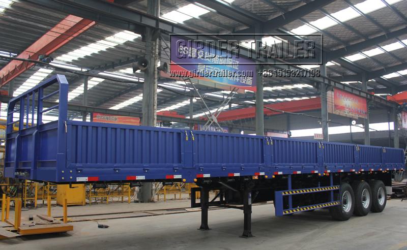 Blue drop side trailer panel warehouse