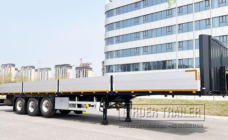 White flatbed side panel trailer