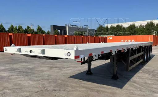 Flatbed trailer loaded with containers