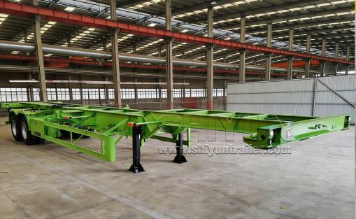 Green skeleton semi trailer in warehouse