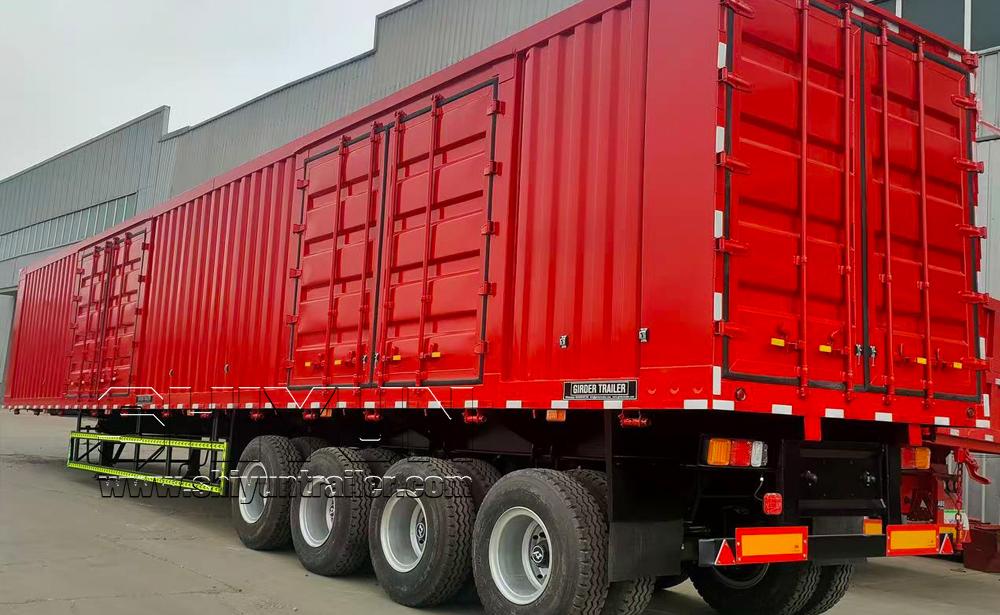 Red dry van semi trailer rear view