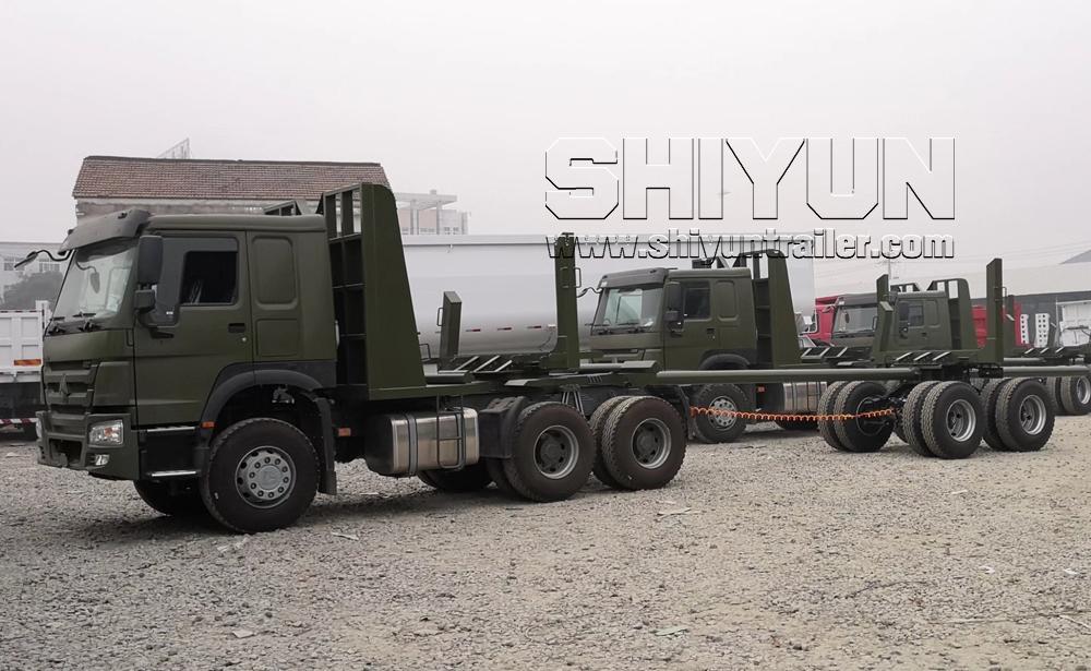 Military truck with log trailer