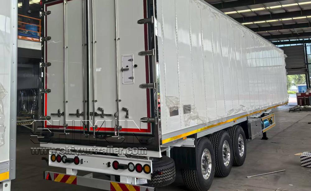 White refrigerated trailer rear angle view