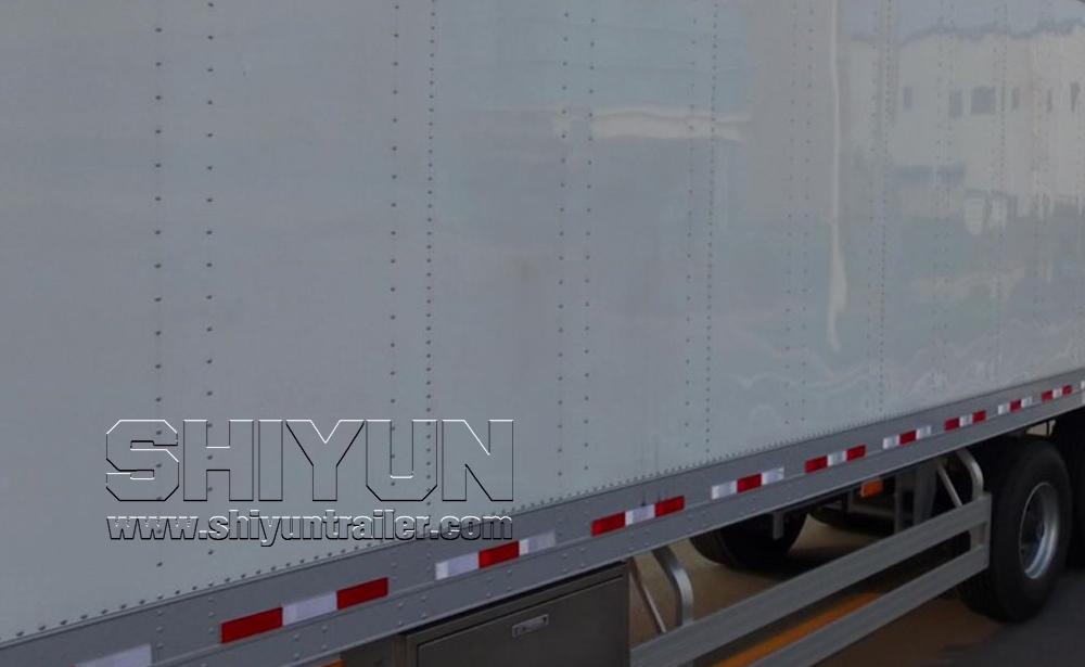 White refrigerated trailer parked