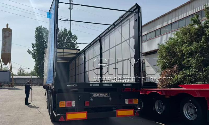 Red curtain side trailer with curtain open