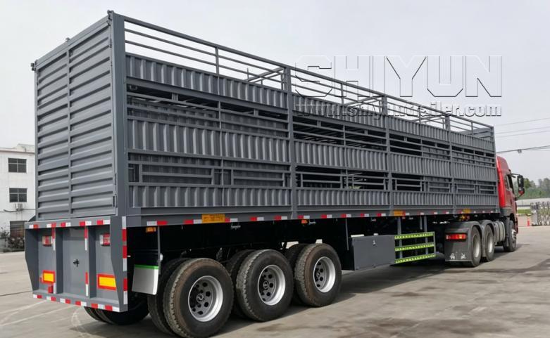 Three deck livestock trailer gray side view