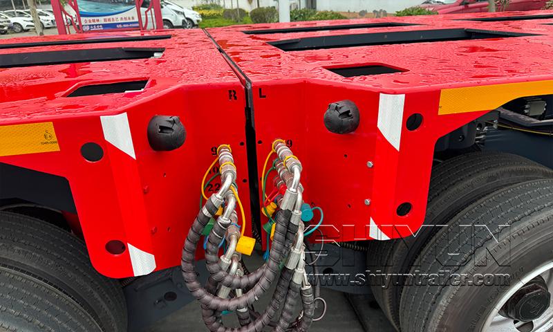 Longitudinal end-by-end module connection with hydraulic hoses