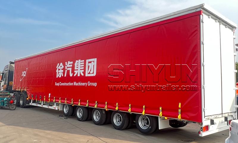 Red curtain side trailer with logo branding