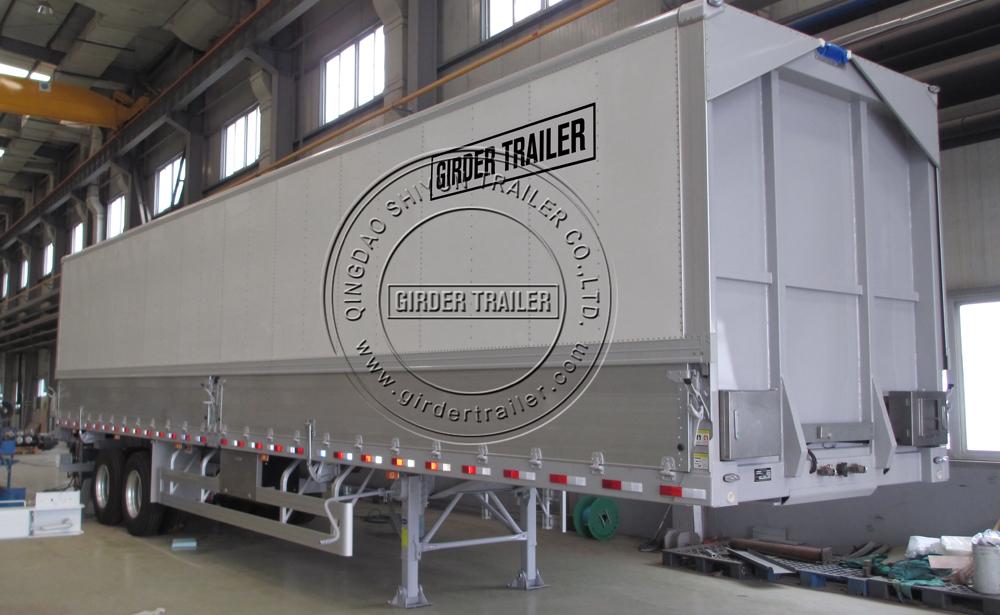 Wing van trailer in factory with signage