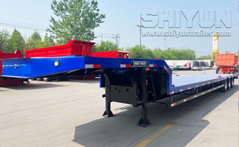 Step wise low flatbed trailer blue with red load