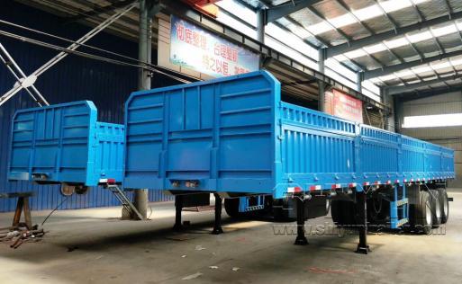 Drop-side flatbed trailer white rear view