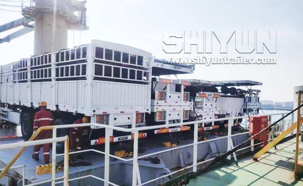 White fence trailers loaded on ship