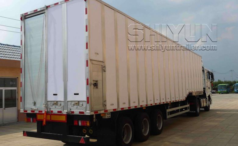 White curtain side livestock trailer rear view