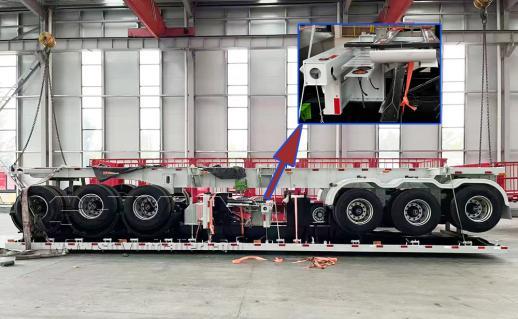 Trailer being loaded into shipping container side view