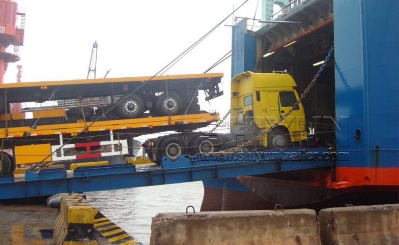 Trailer being loaded onto RoRo vessel with truck