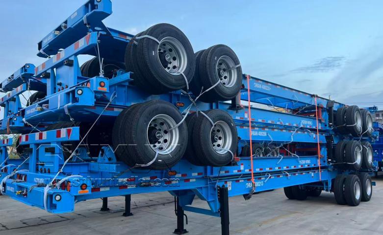 Blue skeleton trailers stacked with tires for RoRo shipping