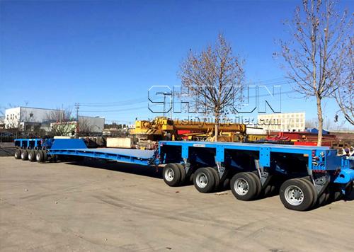Modular trailer with cargo at facility