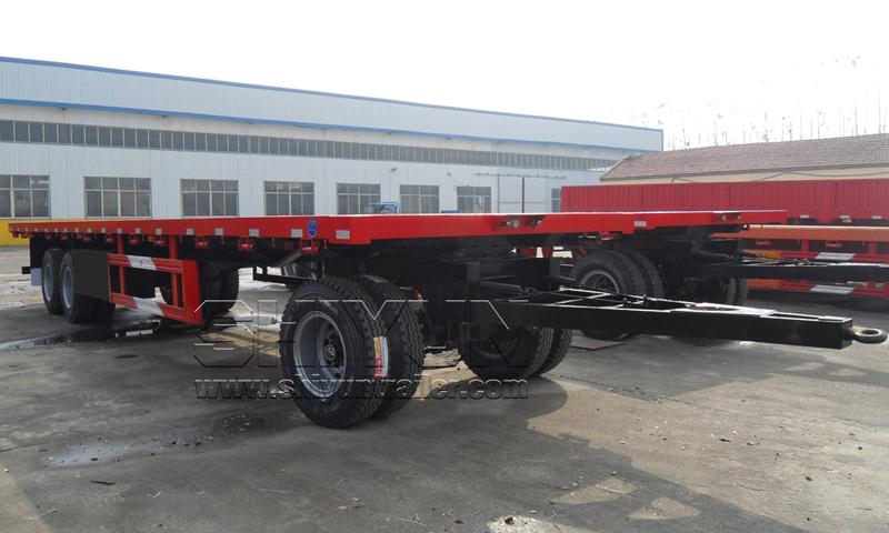 Flatbed draw bar trailer rear axle view